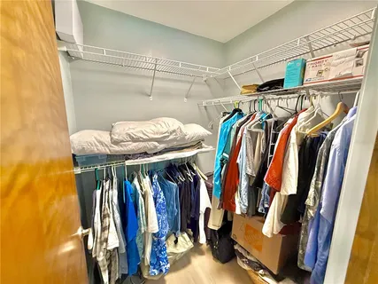 an aerial view of a house with a yard and lake view