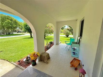 a kitchen with stainless steel appliances granite countertop a sink a stove and a wooden cabinets