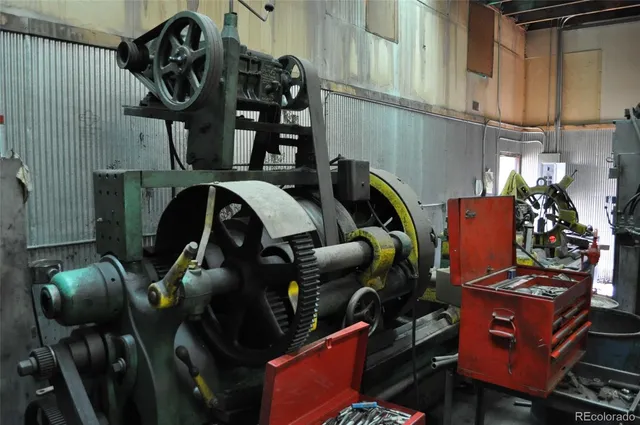 walk in closet with clothes and shoes