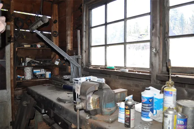 a roof deck with furniture and a potted plant