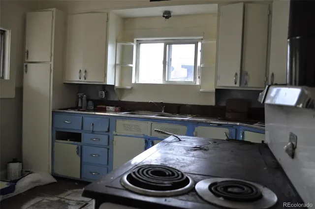 a kitchen with a stove and a sink
