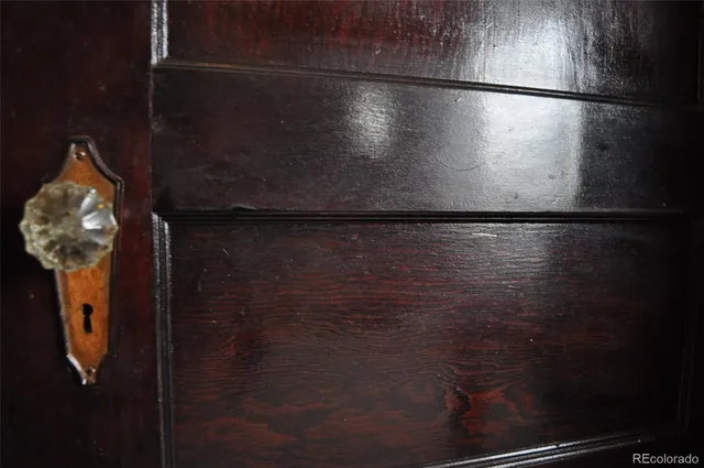 an empty room with wooden floor