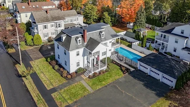 an aerial view of residential houses with outdoor space