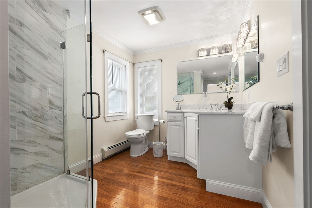 20 Ash Street, Unit 1 Danvers, MA 01923 - Photo 30 of 42 a bathroom with a sink toilet and shower