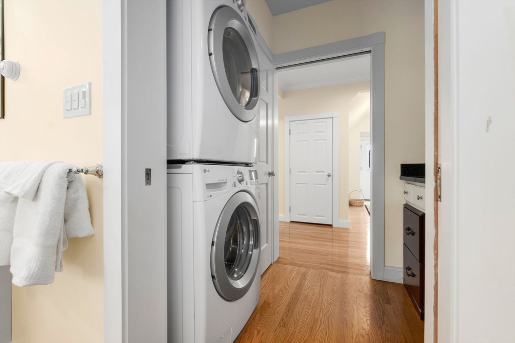 20 Ash Street, Unit 1 Danvers, MA 01923 - Photo 33 of 42 a view of a hallway with washer and dryer