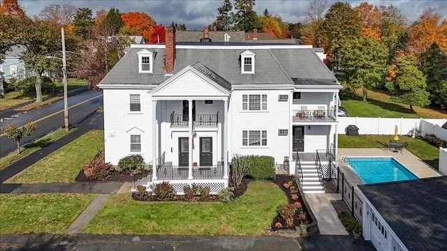 an aerial view of a house with swimming pool