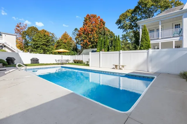 a view of a swimming pool with a patio