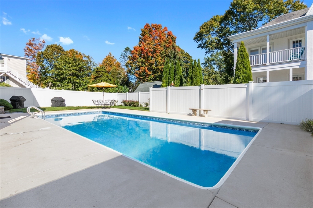 20 Ash Street, Unit 1 Danvers, MA 01923 - Photo 6 of 42 a view of a swimming pool with a patio