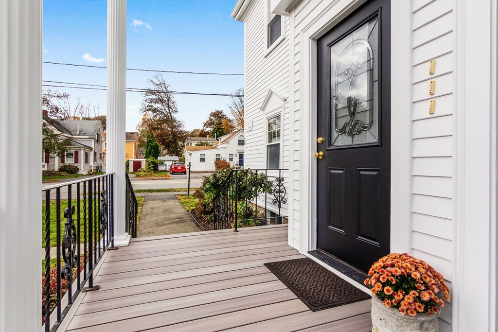 20 Ash Street, Unit 1 Danvers, MA 01923 - Photo 7 of 42 a view of a porch with wooden floor