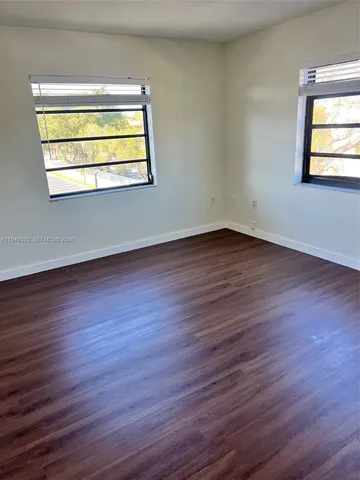 a kitchen with cabinets and white appliances