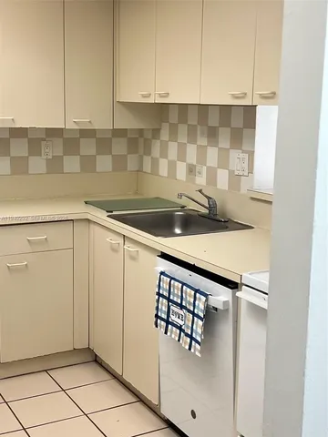 a view of room with wooden floor