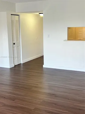 a view of room with wooden floor