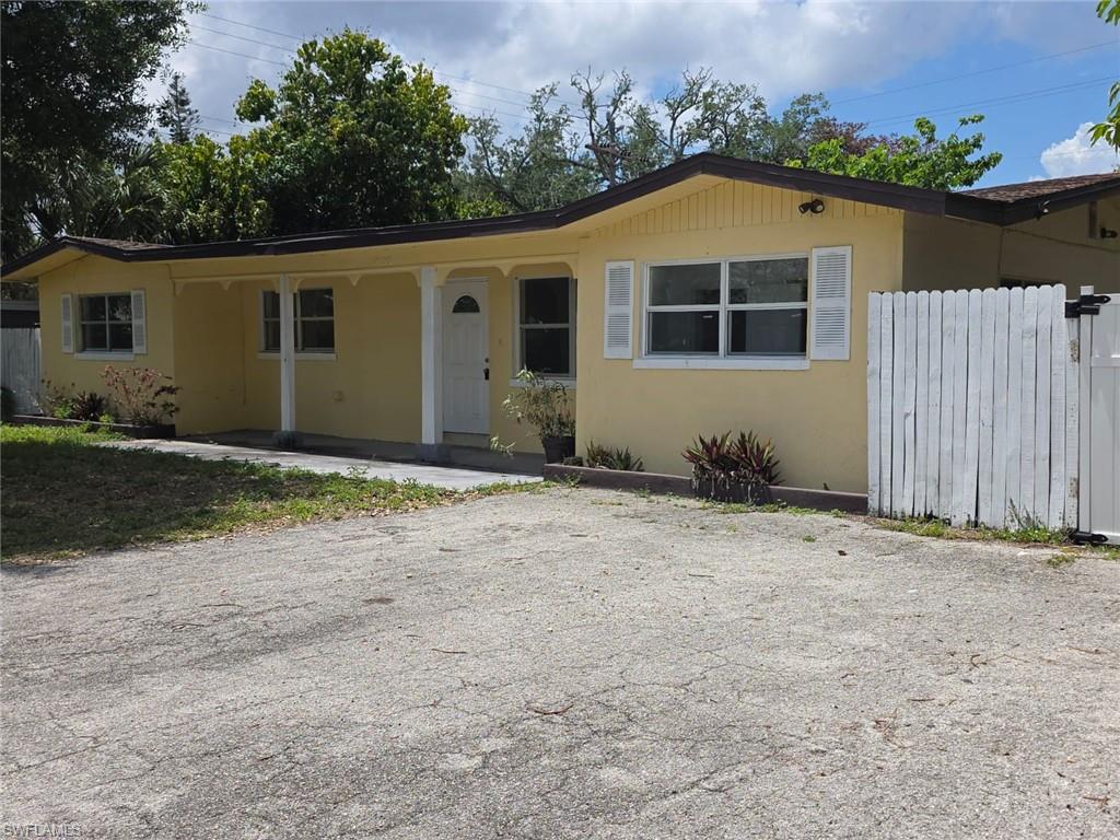 2103 Unity Avenue Fort Myers, FL 33901 - Photo 1 of 40 a front view of a house with a yard