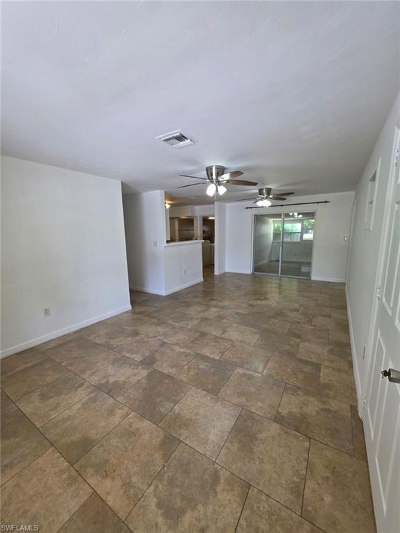 2103 Unity Avenue Fort Myers, FL 33901 - Photo 11 of 40 a view of a hallway with a kitchen