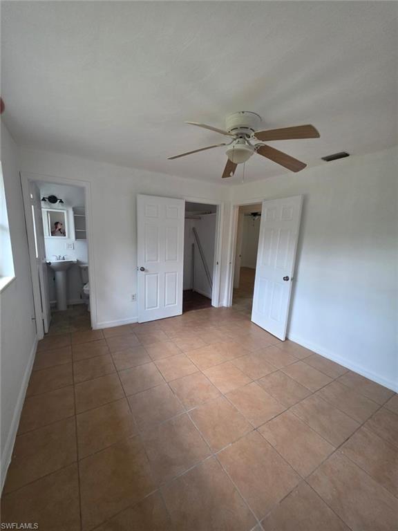 2103 Unity Avenue Fort Myers, FL 33901 - Photo 19 of 40 a view of empty room with closet and fan