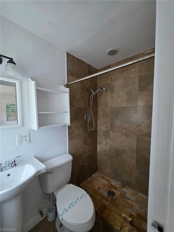 2103 Unity Avenue Fort Myers, FL 33901 - Photo 24 of 40 a bathroom with a sink toilet and shower