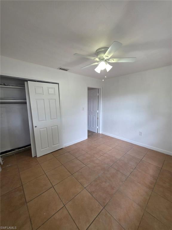 2103 Unity Avenue Fort Myers, FL 33901 - Photo 27 of 40 a view of an empty room with a chandelier fan