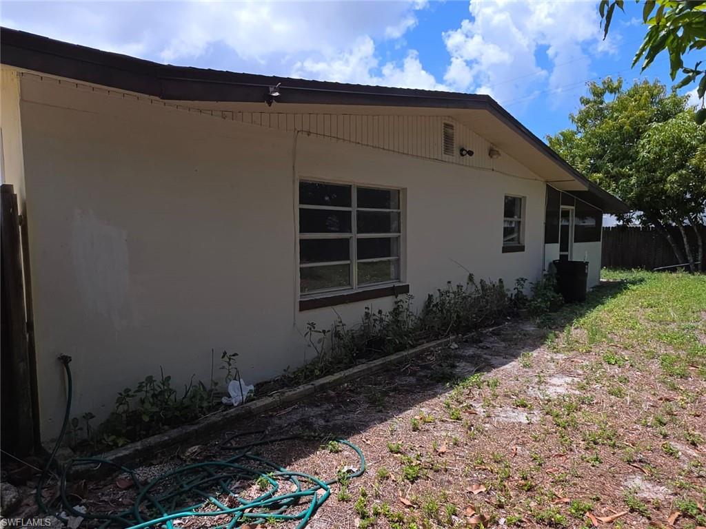 2103 Unity Avenue Fort Myers, FL 33901 - Photo 29 of 40 a front view of a house with garden