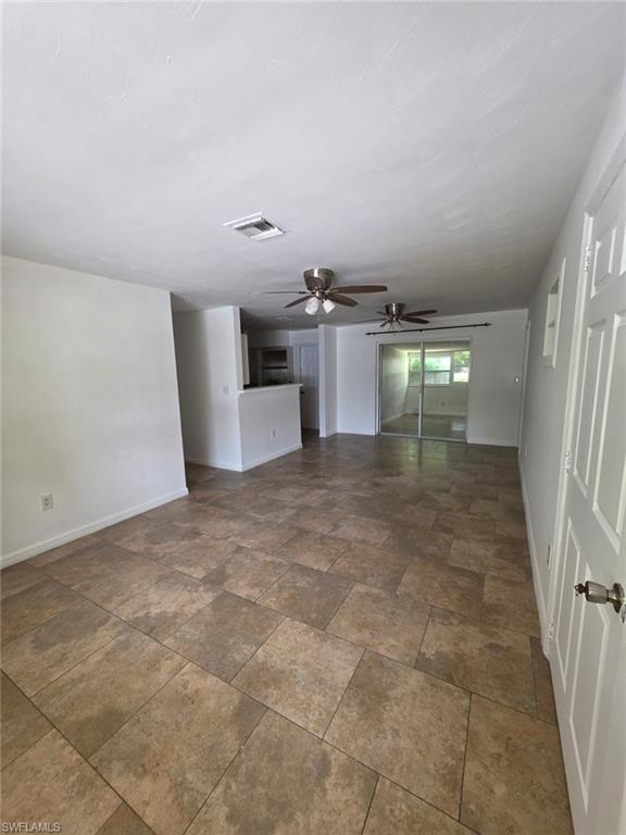2103 Unity Avenue Fort Myers, FL 33901 - Photo 3 of 40 a view of a kitchen with furniture and an empty room
