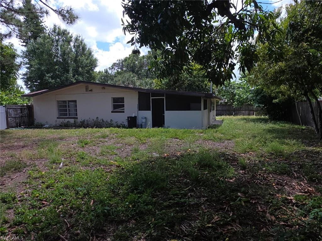 2103 Unity Avenue Fort Myers, FL 33901 - Photo 32 of 40 a house with green field in front of it