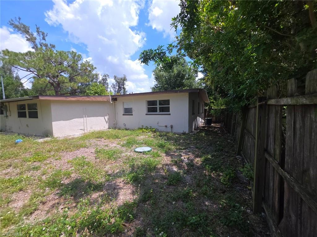 2103 Unity Avenue Fort Myers, FL 33901 - Photo 34 of 40 a backyard of a house with plants and tree