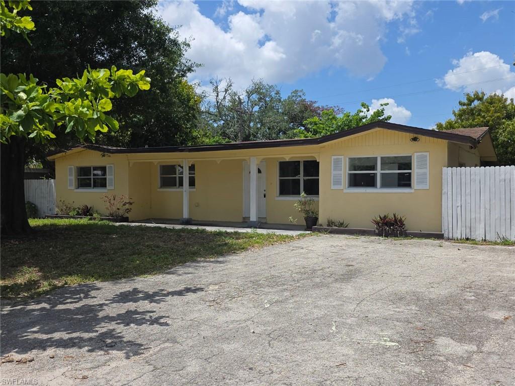 2103 Unity Avenue Fort Myers, FL 33901 - Photo 39 of 40 a front view of a house with a yard and garage