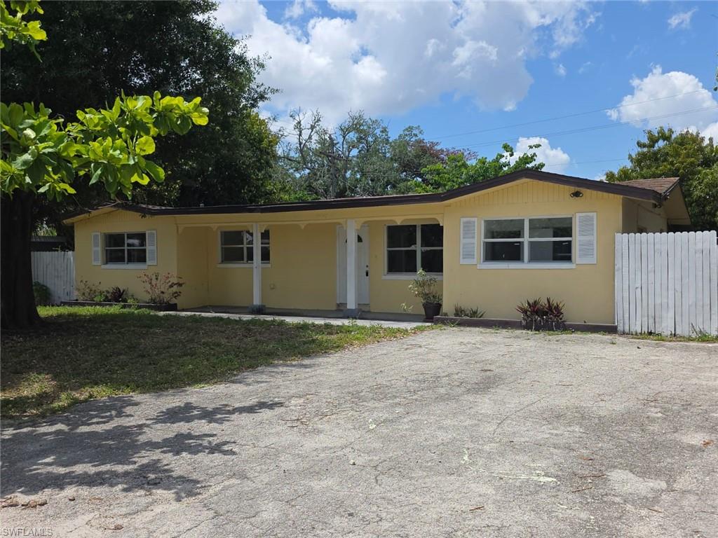 2103 Unity Avenue Fort Myers, FL 33901 - Photo 40 of 40 a front view of a house with a yard and garage