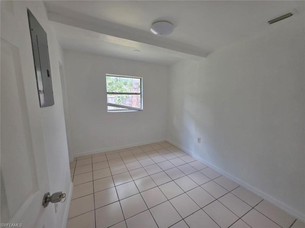 2103 Unity Avenue Fort Myers, FL 33901 - Photo 6 of 40 a view of an empty room and window