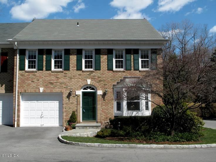 13 Georgetowne North, Unit 13 Greenwich, CT 06831 - Photo 1 of 17 front view of house with a yard
