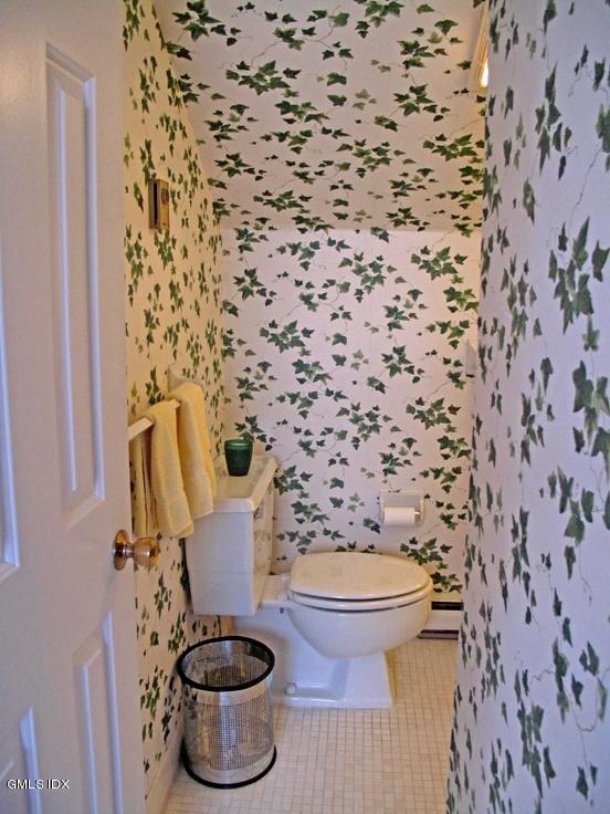 13 Georgetowne North, Unit 13 Greenwich, CT 06831 - Photo 13 of 17 a bathroom with a toilet and a shower curtain