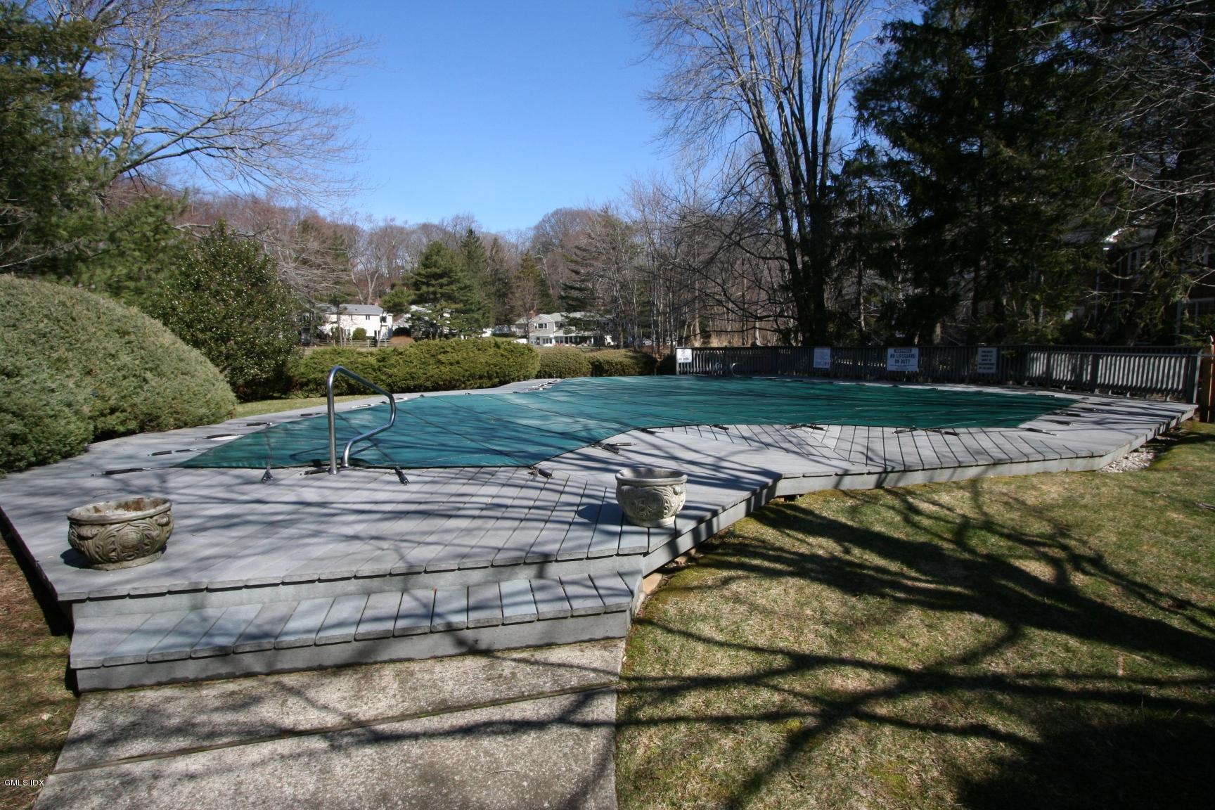 13 Georgetowne North, Unit 13 Greenwich, CT 06831 - Photo 16 of 17 a view of a backyard with trees