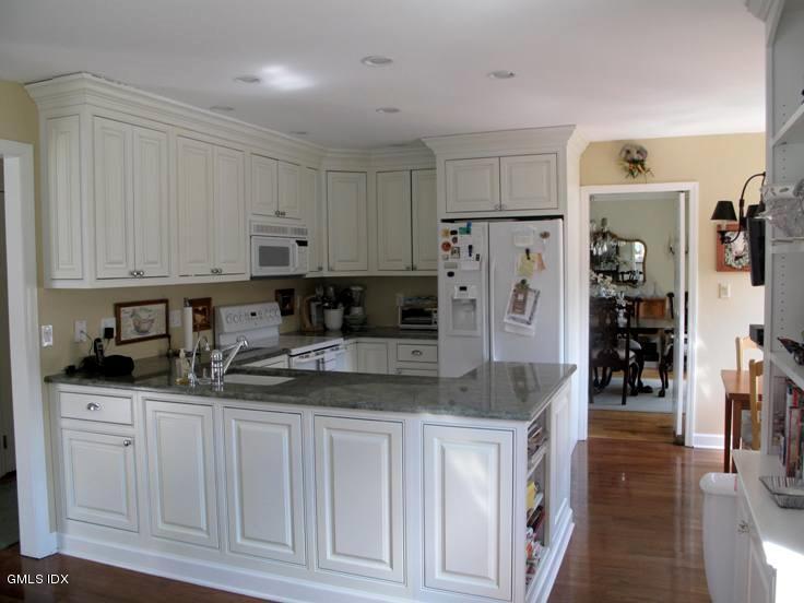 13 Georgetowne North, Unit 13 Greenwich, CT 06831 - Photo 2 of 17 a kitchen with stainless steel appliances granite countertop a refrigerator and sink