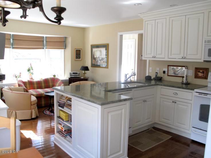 13 Georgetowne North, Unit 13 Greenwich, CT 06831 - Photo 3 of 17 a kitchen with stainless steel appliances granite countertop a sink and a cabinets