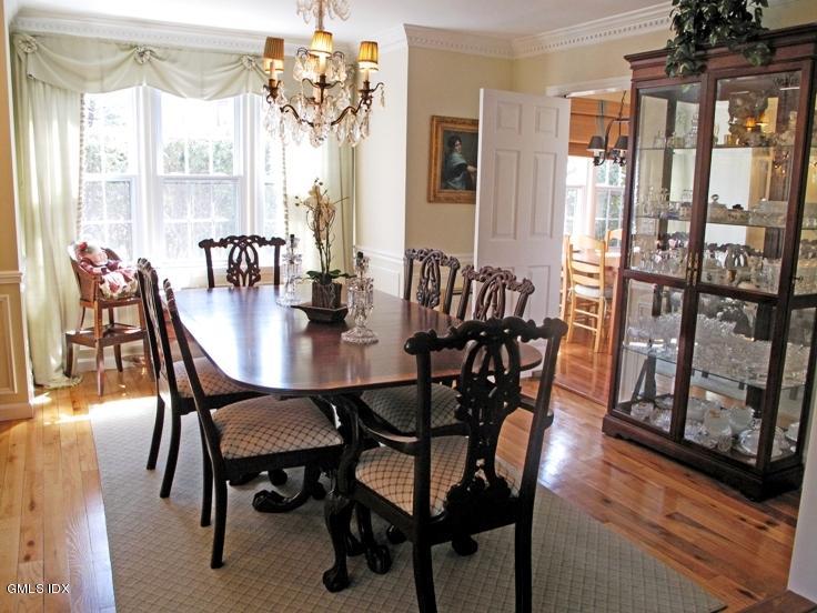 13 Georgetowne North, Unit 13 Greenwich, CT 06831 - Photo 4 of 17 a view of a dining room with furniture window and wooden floor