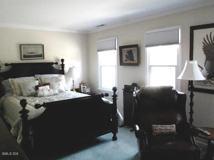 13 Georgetowne North, Unit 13 Greenwich, CT 06831 - Photo 10 of 17 a living room with furniture a window and a lamp