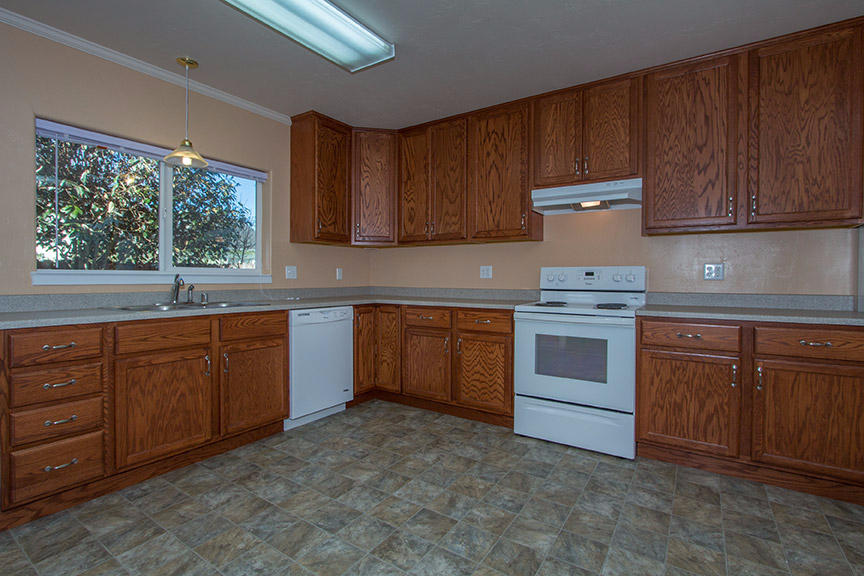 1732 Ash Street Fortuna, CA 95540 - Photo 7 of 37 a kitchen with sink a stove and cabinets