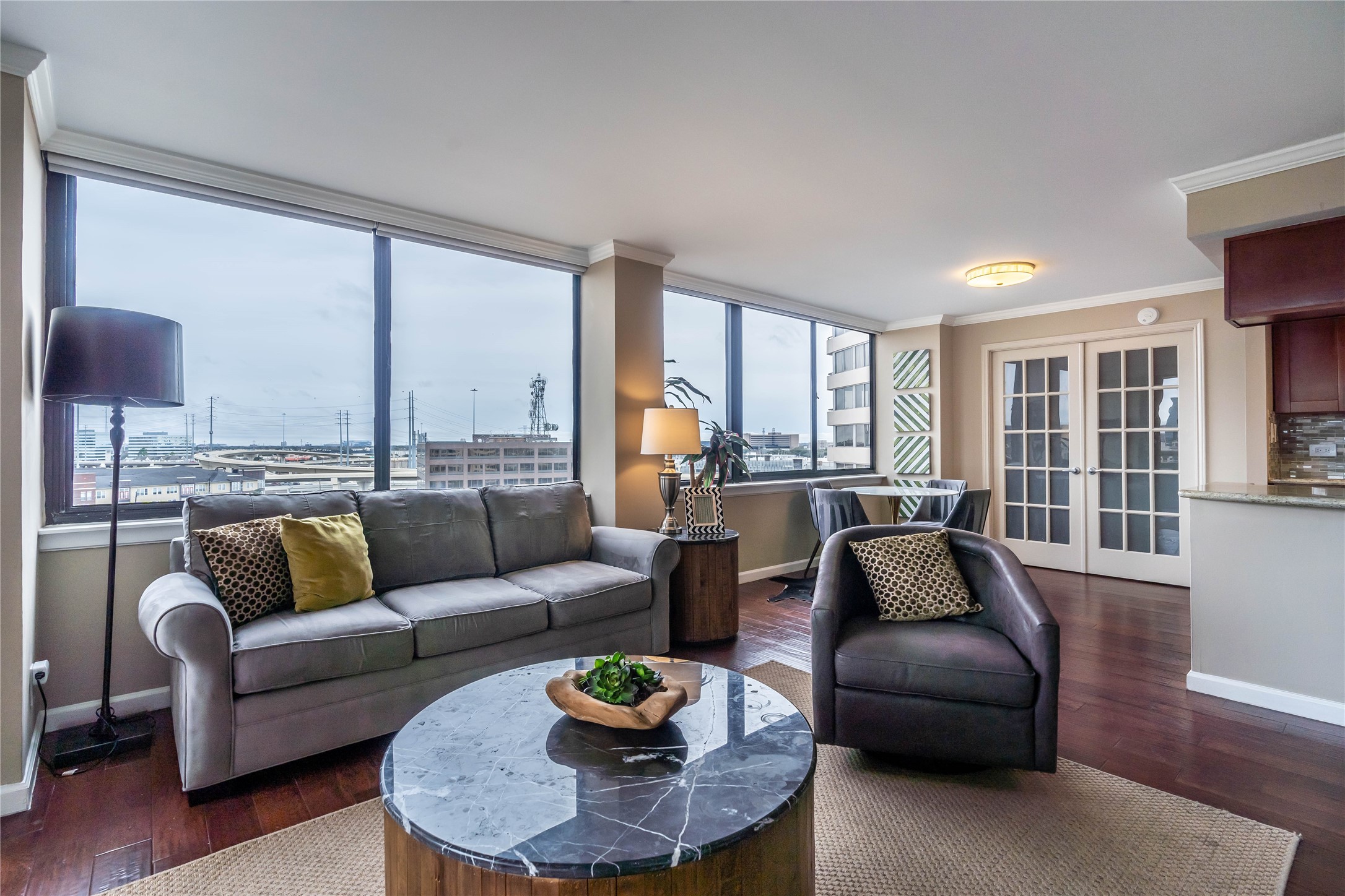 3525 Sage Road, Unit 1009 Houston, TX 77056 - Photo 2 of 23 a living room with furniture and a large window