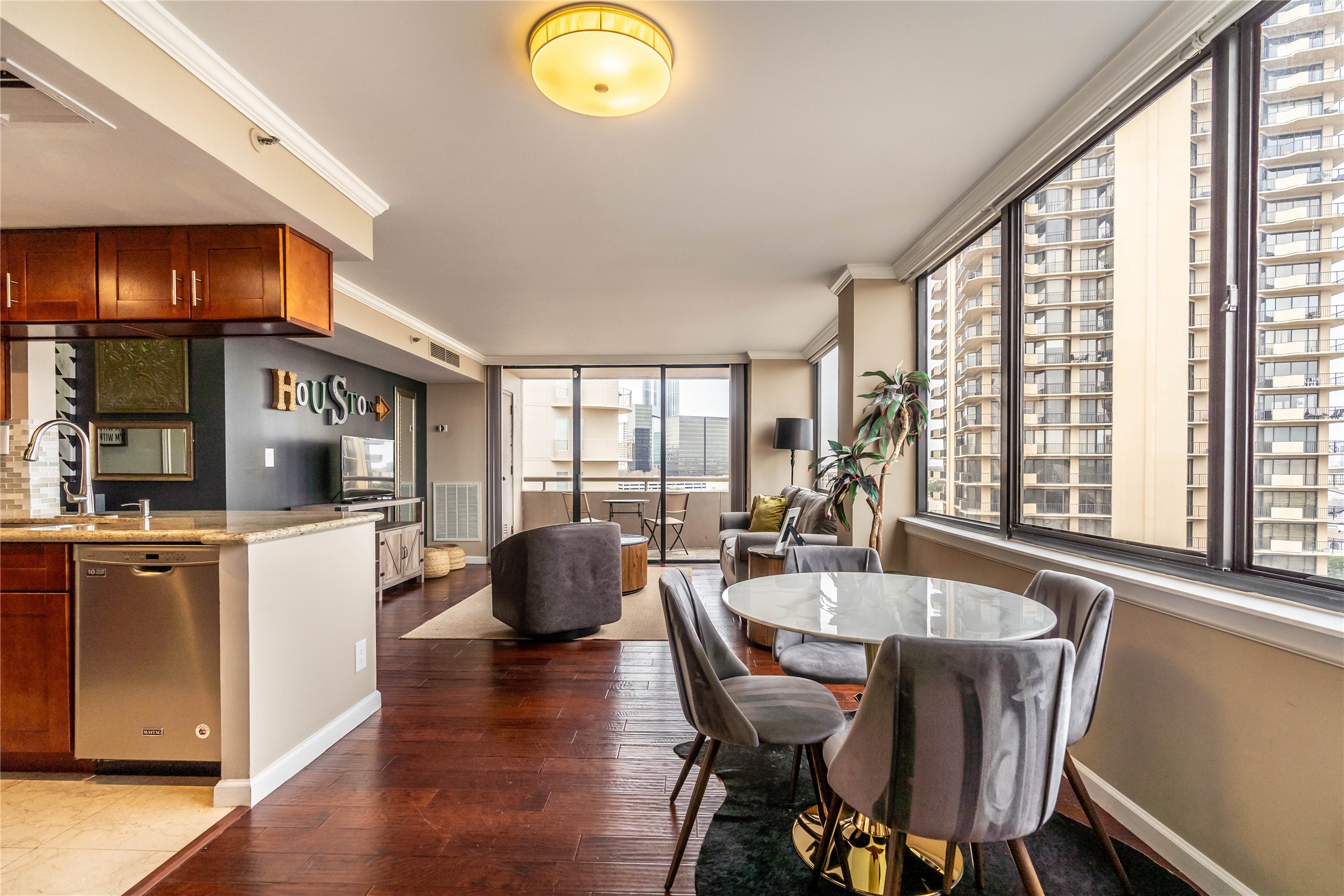 3525 Sage Road, Unit 1009 Houston, TX 77056 - Photo 6 of 23 a dining room with furniture window wooden floor
