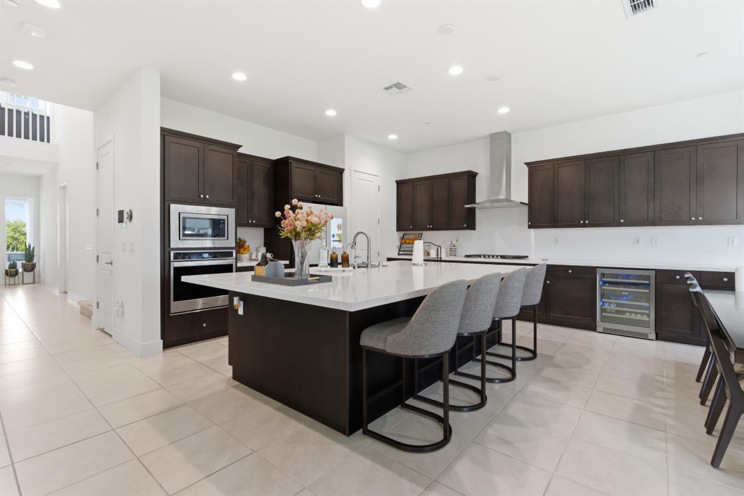 3233 Kipling Drive Lathrop, CA 95330 - Photo 18 of 39 a large kitchen with a table and chairs