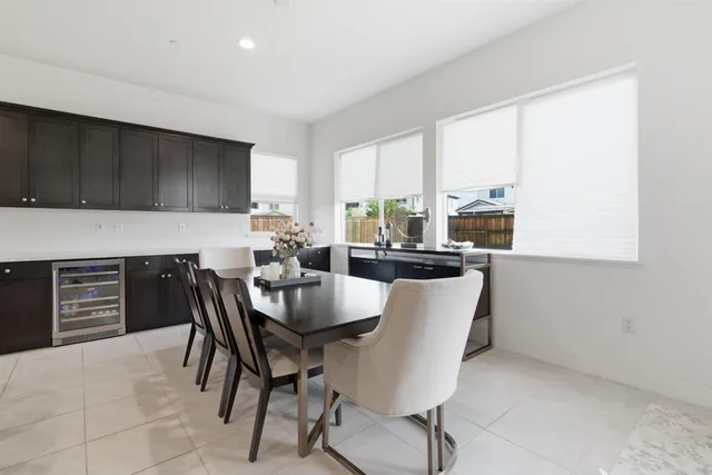 a large kitchen with a table and chairs
