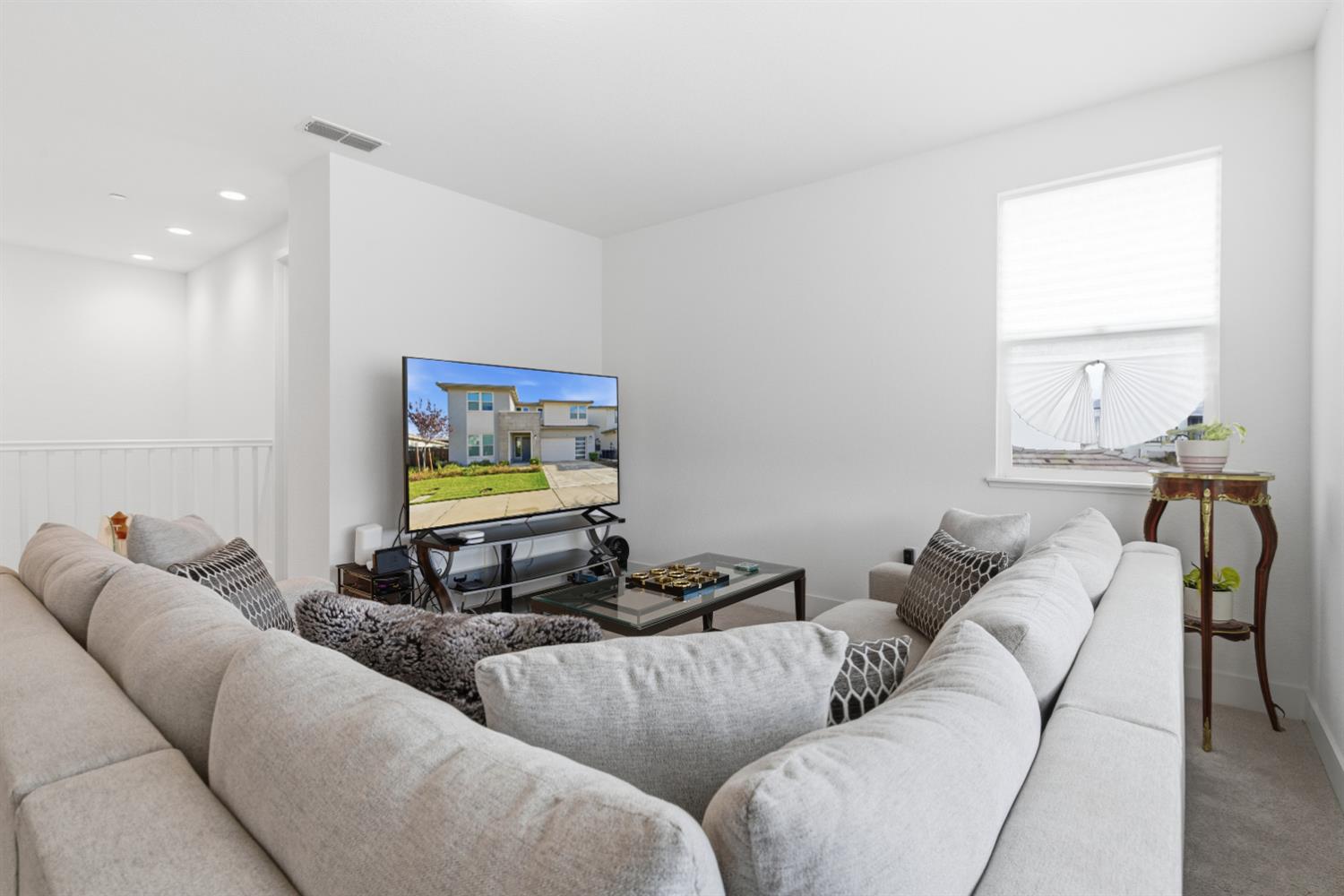 3233 Kipling Drive Lathrop, CA 95330 - Photo 23 of 39 a living room with furniture and a flat screen tv