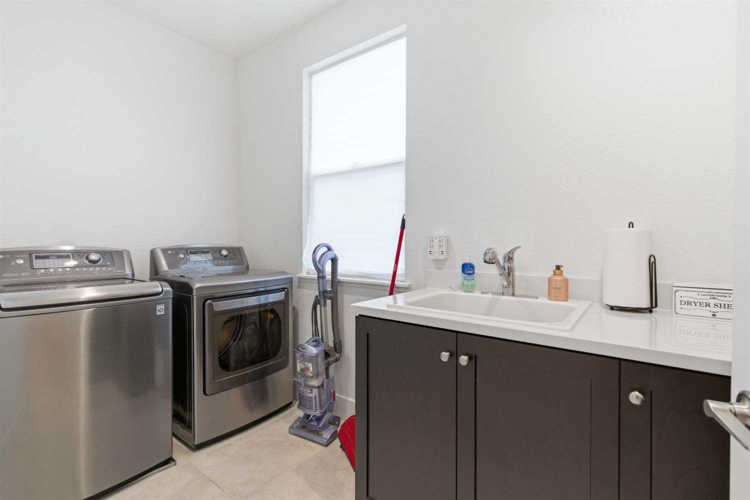 3233 Kipling Drive Lathrop, CA 95330 - Photo 24 of 39 a utility room with sink dryer and washer