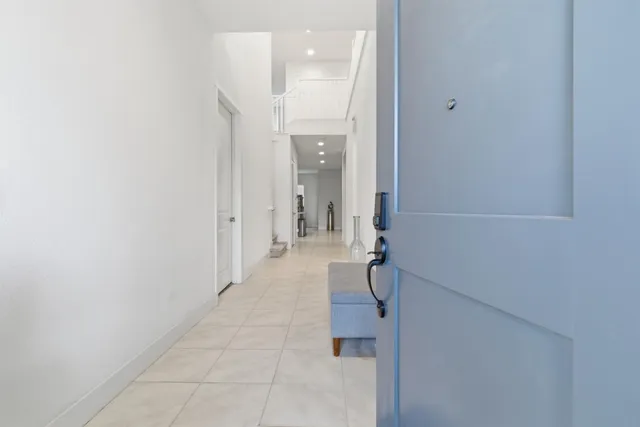 a room with furniture and a potted plant