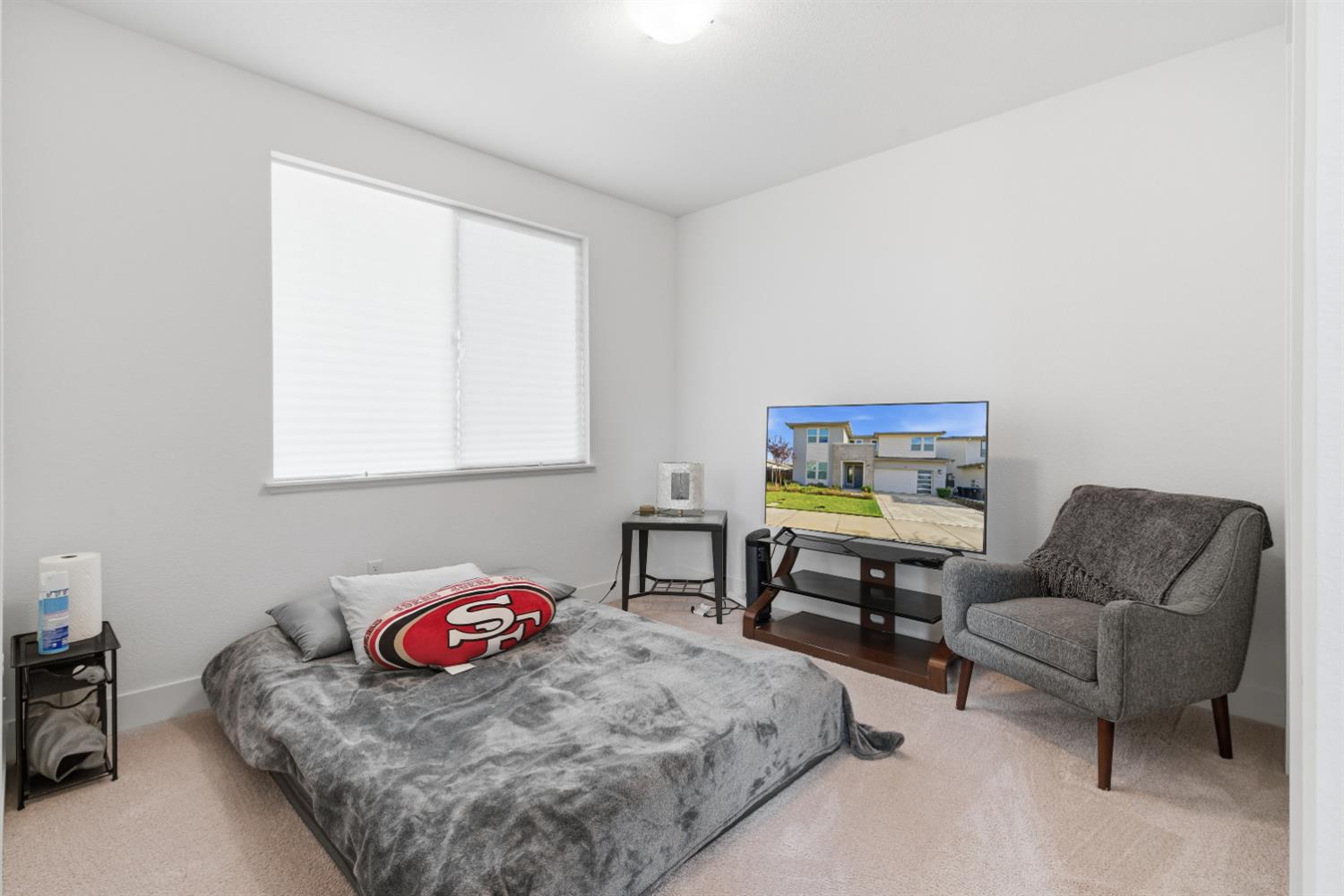 3233 Kipling Drive Lathrop, CA 95330 - Photo 28 of 39 a bedroom with furniture and a window