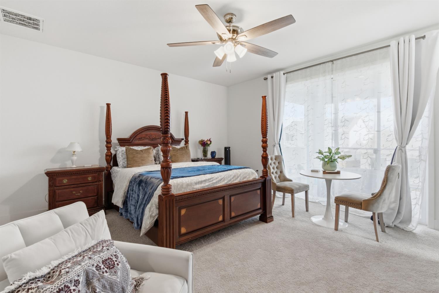 3233 Kipling Drive Lathrop, CA 95330 - Photo 31 of 39 a bedroom with furniture and a chandelier