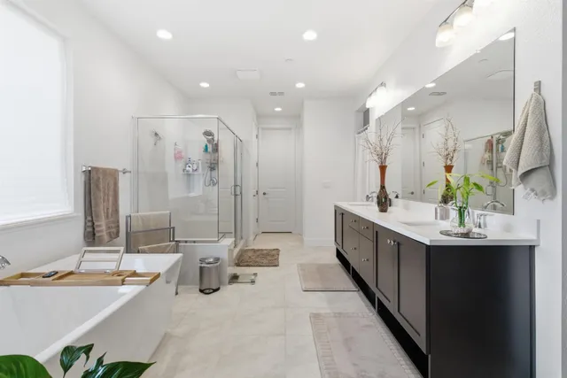 a bedroom with furniture and a chandelier