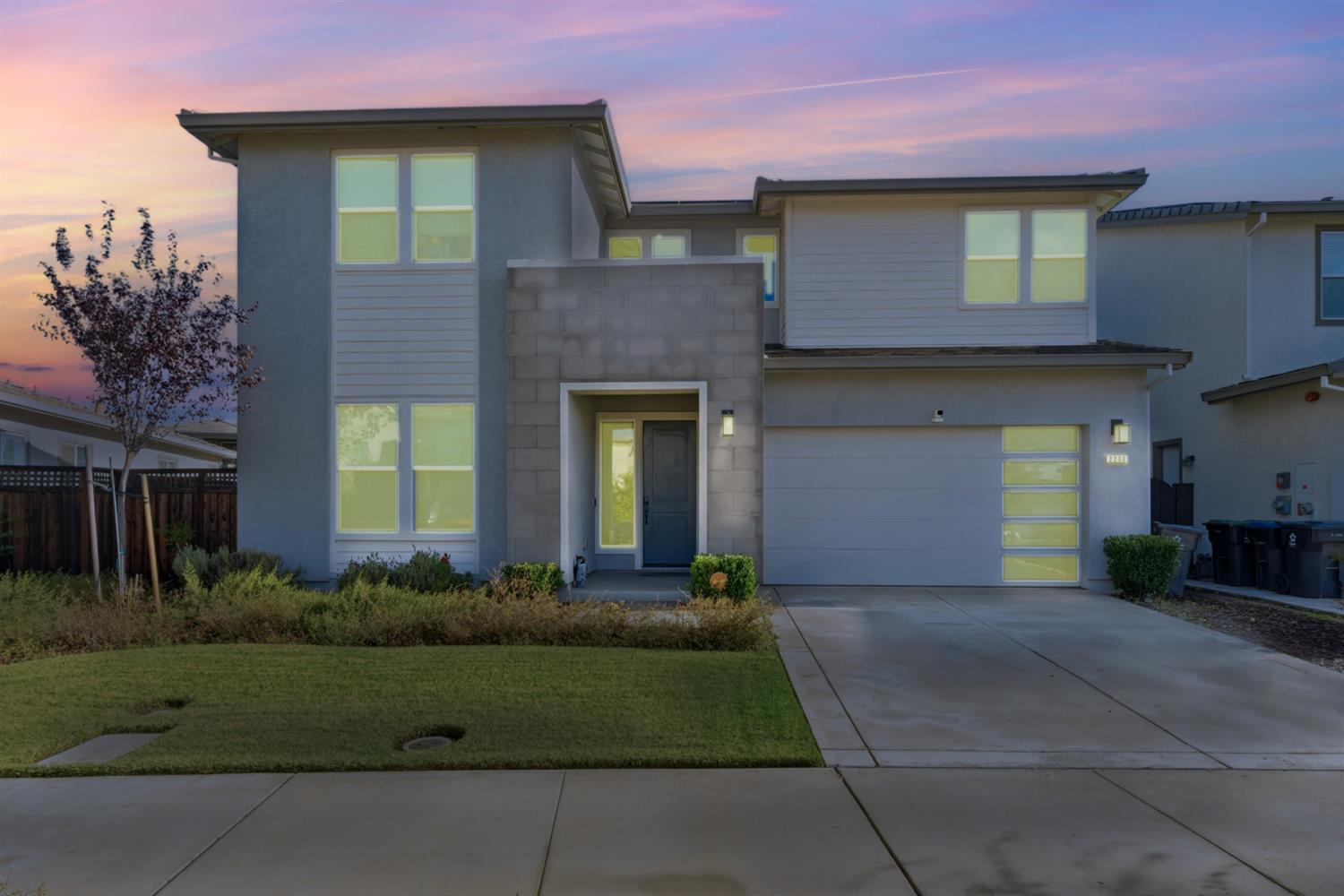 3233 Kipling Drive Lathrop, CA 95330 - Photo 36 of 39 a front view of a house with a yard and garage