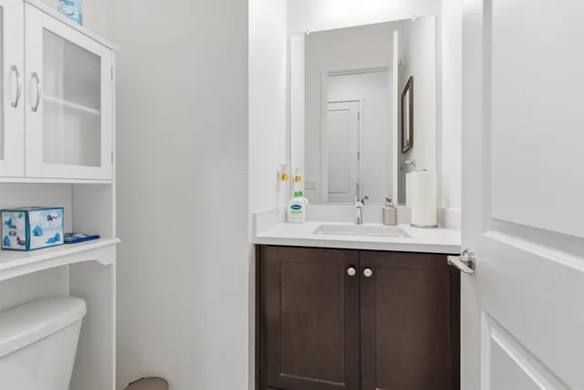 a living room with kitchen island furniture and a sink