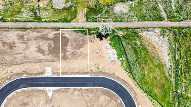 3248 South 1125th West, Unit 22 Logan, UT 84321 - Photo 2 of 20 Cleared building lot fronting a newly paved street