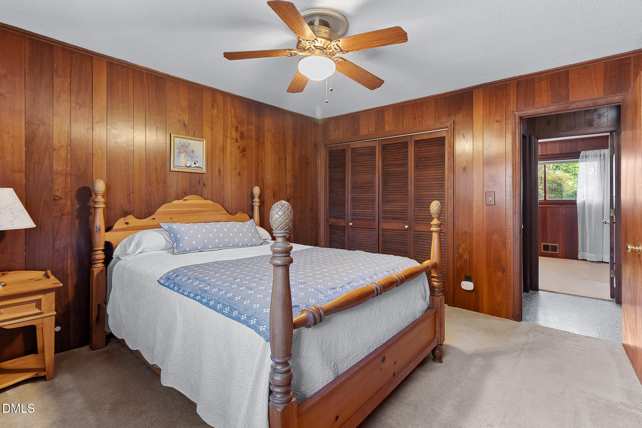 1704 Marshburn Road Wendell, NC 27591 - Photo 15 of 27 a bed room with a bed and a chandelier